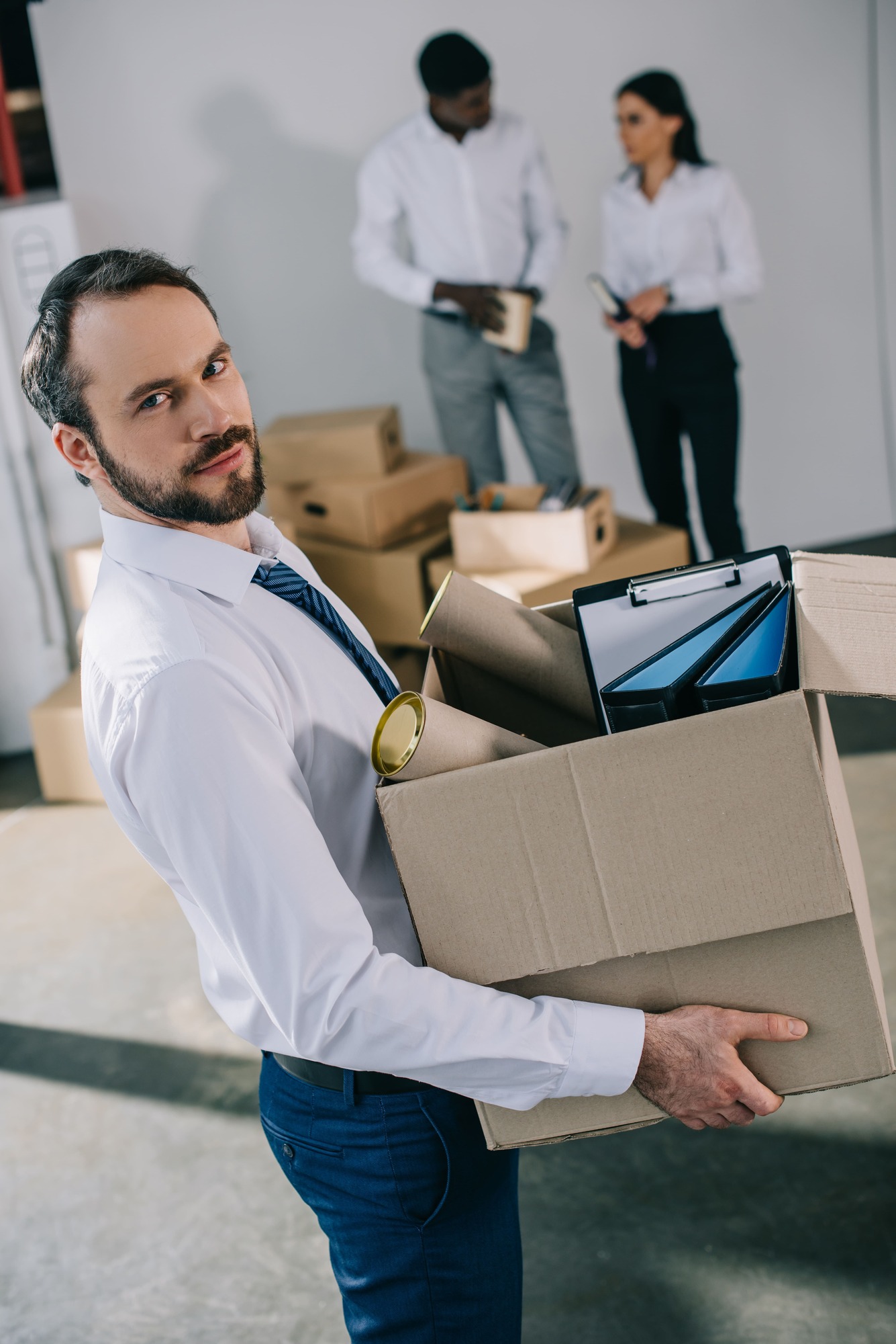 businessman-holding-cardboard-box-with-office-supp-2023-11-27-05-28-31-utc (1) (1)